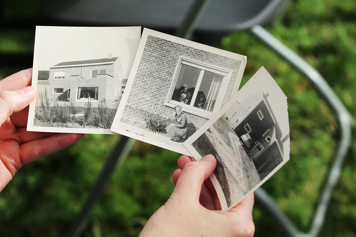 hands holding old photographs